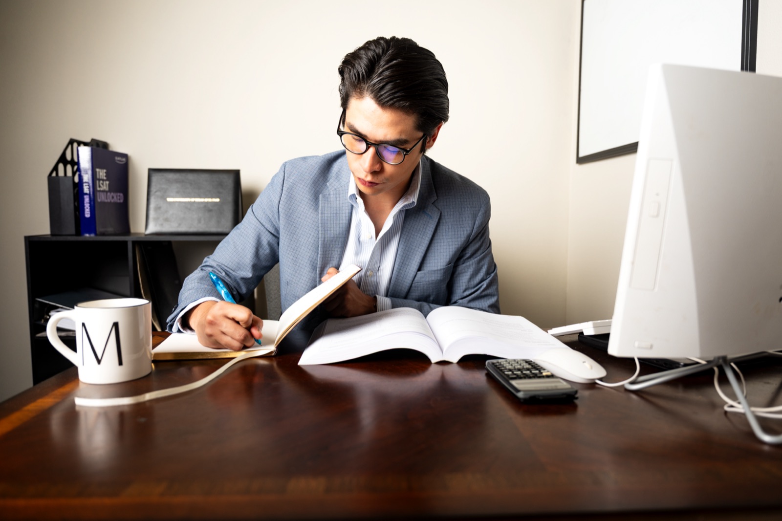 Michael A. Munoz working at his desk at MAM Accounting, Tax & Financial Services