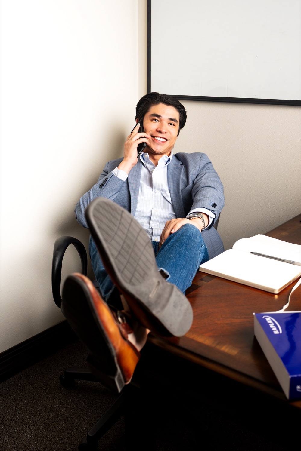 Michael Munoz at his office desk